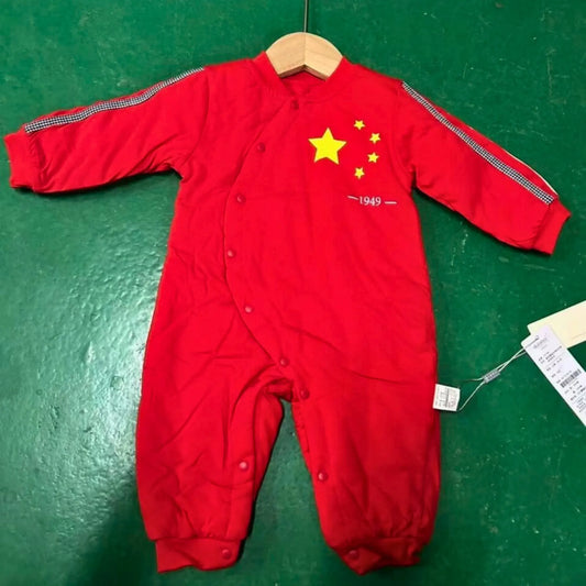 Red baby snowsuit with Chinese flag design on a green surface