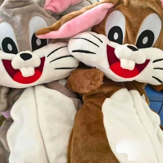 Plush toys resembling cartoon characters with a focus on a rabbit-like figure.