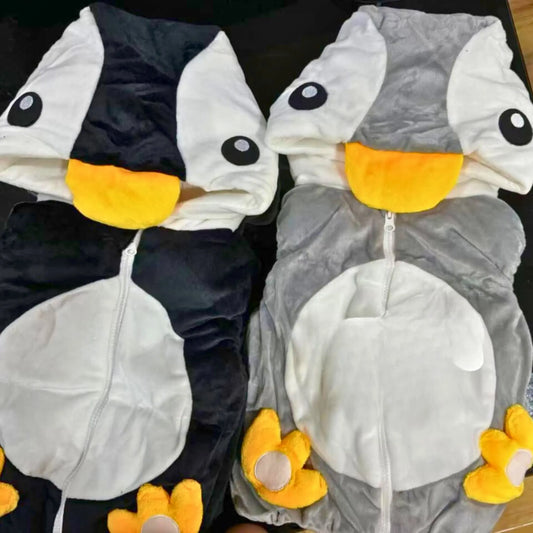 Two cartoonish animal costumes, one black and white, the other gray and white, on a dark background.