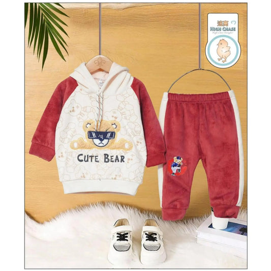 Children's outfit with hoodie and pants on a wooden background