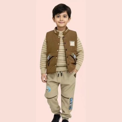 Child wearing a brown vest and beige pants on a pink background