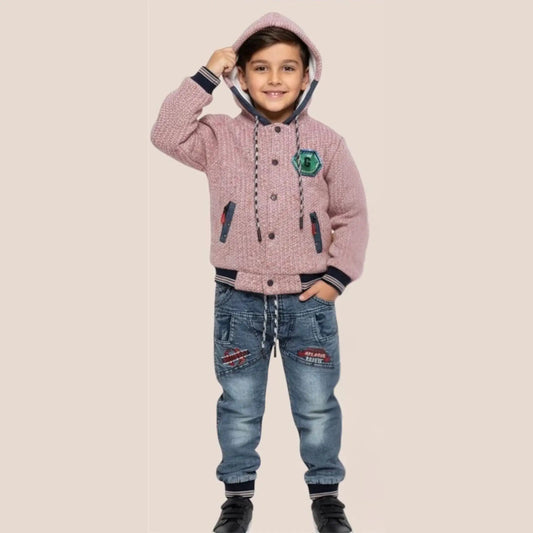 Child wearing a pink hooded jacket and blue jeans on a beige background