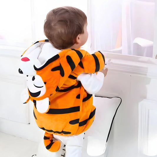 Child wearing a tiger-themed onesie with a white background